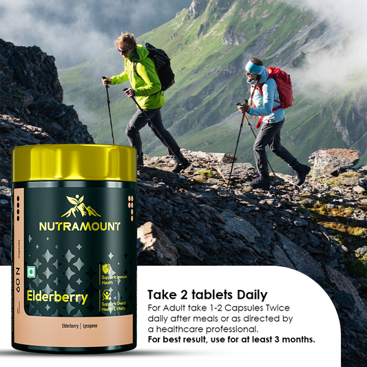 Two hikers trekking up a rocky mountain ridge, positioned next to a Nutramount Elderberry supplement bottle. Text provides dosage instructions, recommending 1-2 capsules daily for at least 3 months for best results.