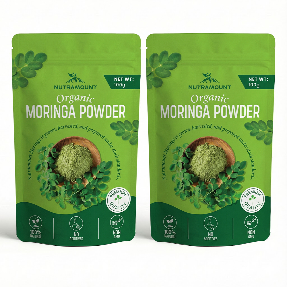 Two identical 100g pouches of Nutramount Organic Moringa Powder side-by-side, featuring light green packaging with premium quality and 100% natural badges.
