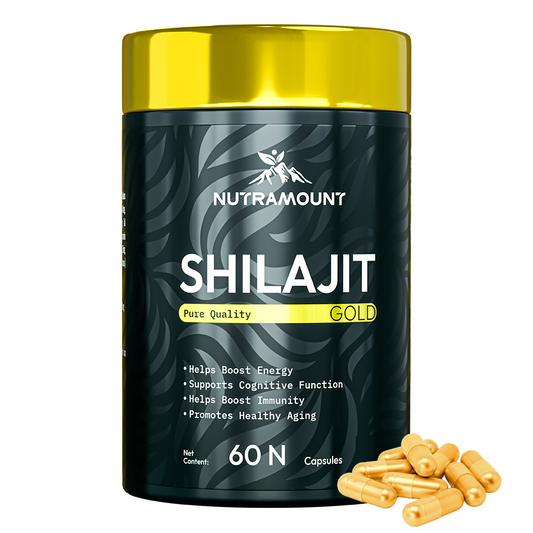 A black and gold bottle of Nutramount Shilajit Gold capsules with several gold capsules spilled beside it. The label highlights benefits including boosted energy, cognitive support, and immunity.
